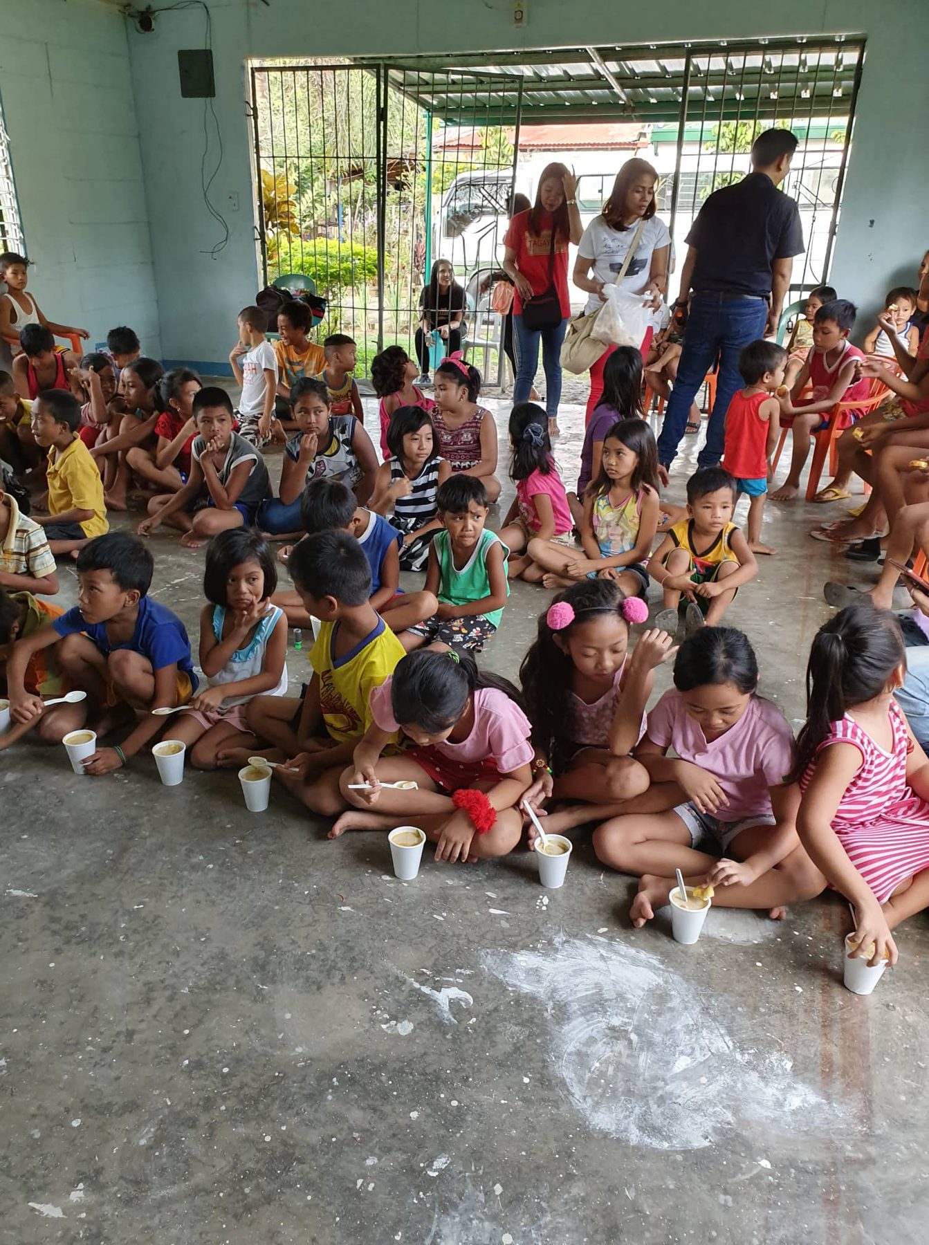 Children eating during feeding program